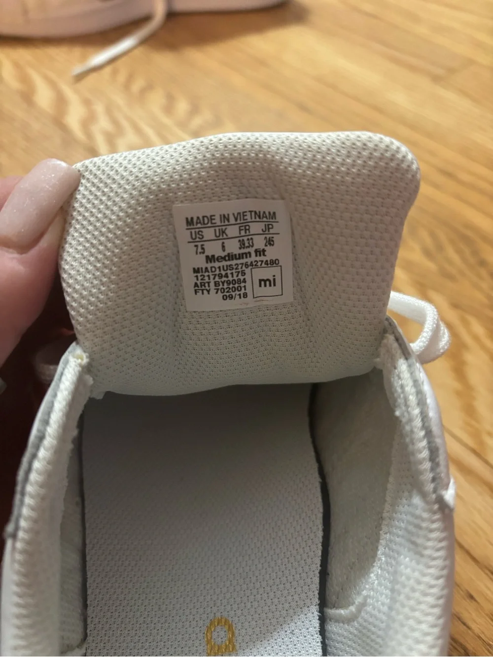 adidas Women's White Sneakers with Gold Stripe Accents